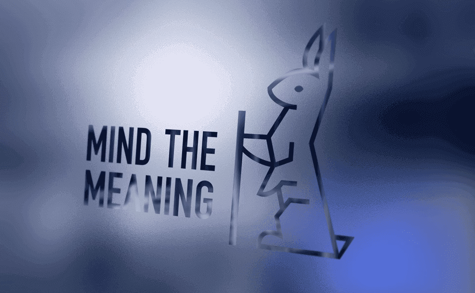 Mind the Meaning logo applied to translucent office glass.